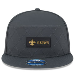 New Orleans Saints New Era 2025 Sideline Cold Weather Split Panel 9FIFTY Snapback Hat